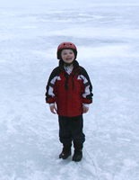 Click to enlarge photo of Ice skating on park pond.